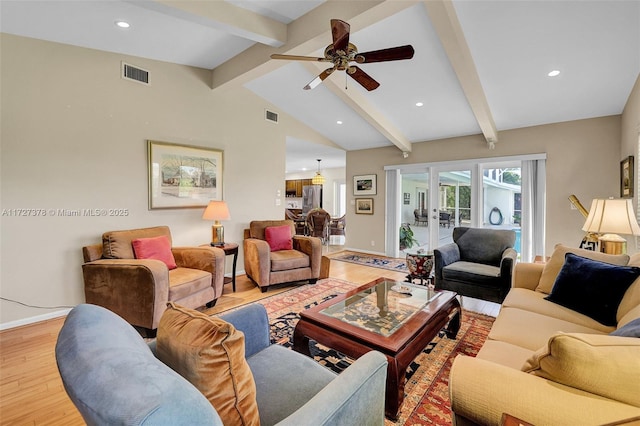 living room with light wood-type flooring, ceiling fan, french doors, and lofted ceiling with beams