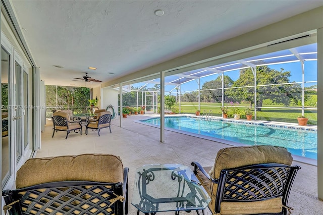 view of pool featuring a lanai, ceiling fan, area for grilling, and a patio