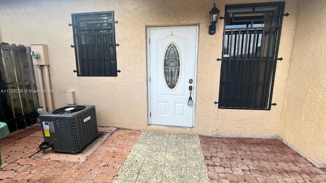 doorway to property with central air condition unit