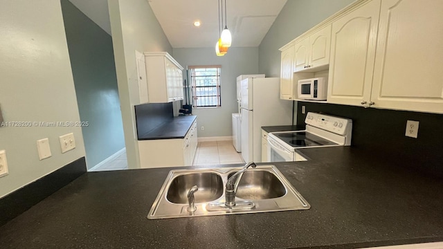 kitchen with white appliances, white cabinetry, sink, hanging light fixtures, and light tile patterned floors