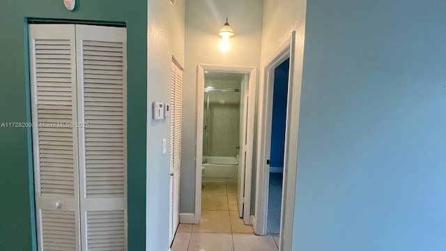 corridor featuring light tile patterned floors