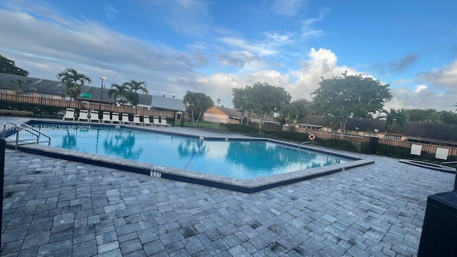 view of swimming pool with a patio