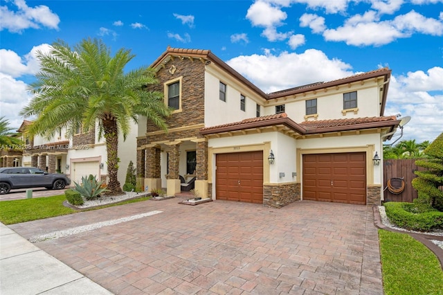 mediterranean / spanish house featuring a garage