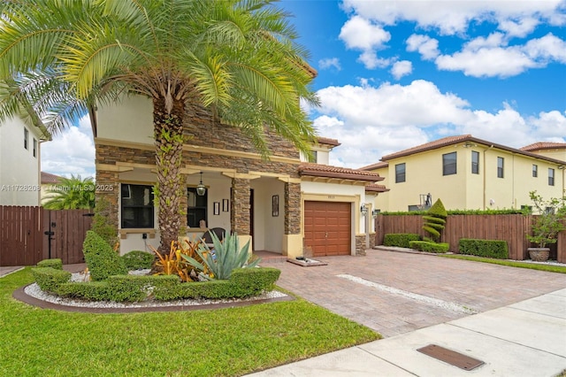 mediterranean / spanish-style home with a garage