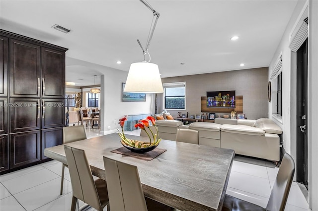 dining area with light tile patterned floors