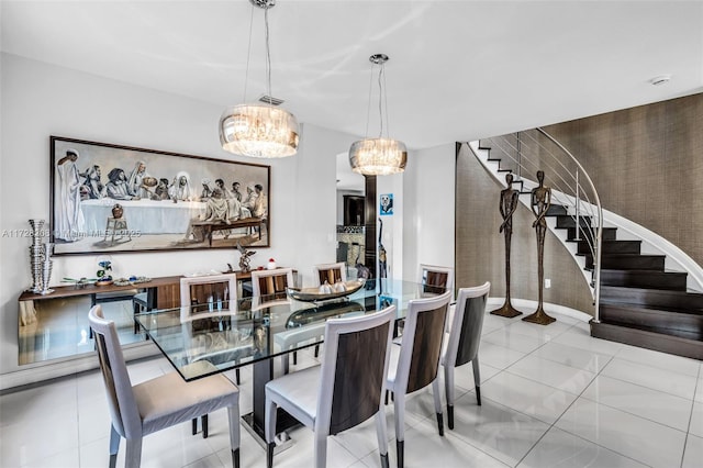 tiled dining area featuring a notable chandelier