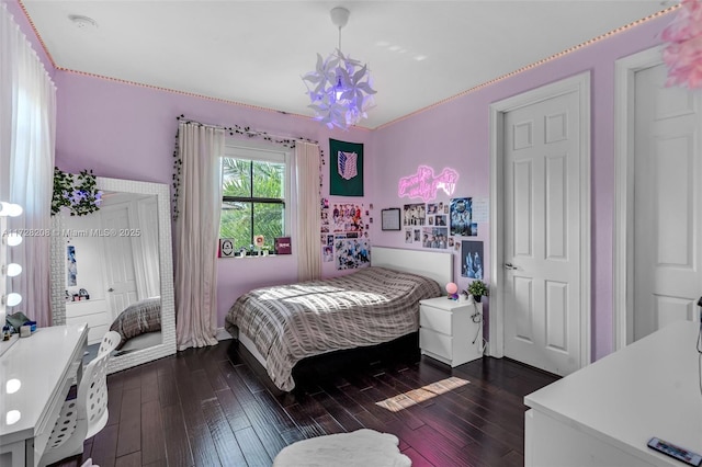 bedroom featuring dark hardwood / wood-style flooring