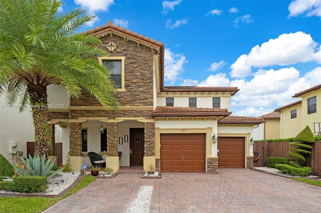 mediterranean / spanish-style home featuring a garage