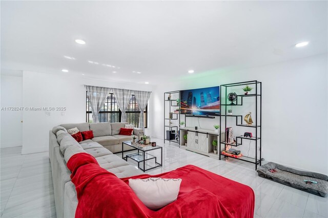 living room with light tile patterned floors