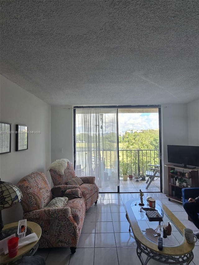 tiled living room with a wall of windows and a textured ceiling