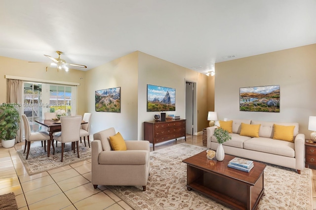 tiled living room with ceiling fan