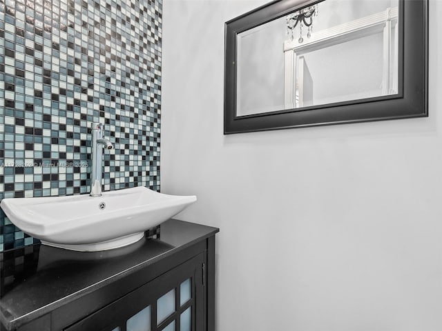 bathroom featuring backsplash and vanity