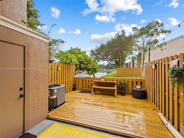 deck with central AC and a water view