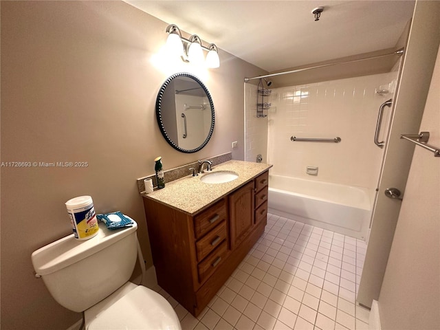 full bathroom featuring vanity, tile patterned floors, toilet, and tiled shower / bath