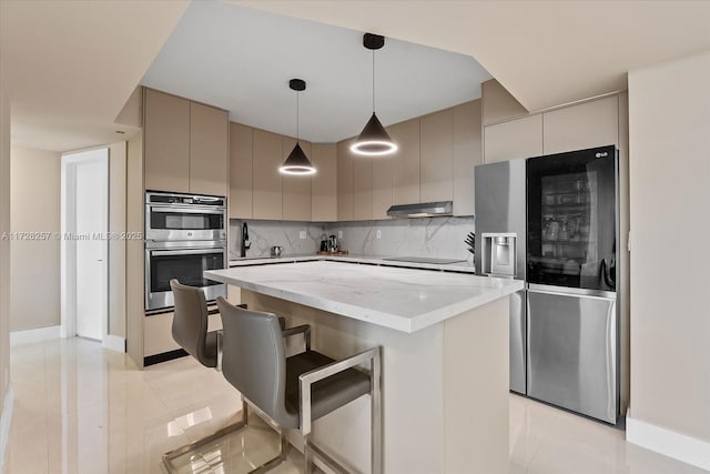 kitchen with a center island, decorative backsplash, hanging light fixtures, appliances with stainless steel finishes, and gray cabinetry