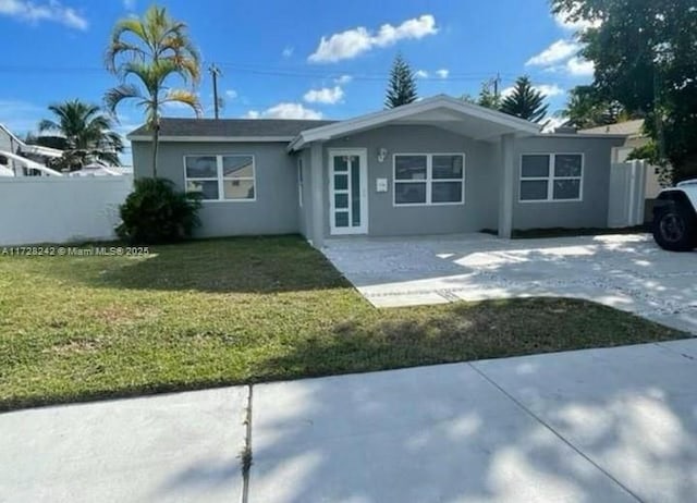 ranch-style home with a front lawn