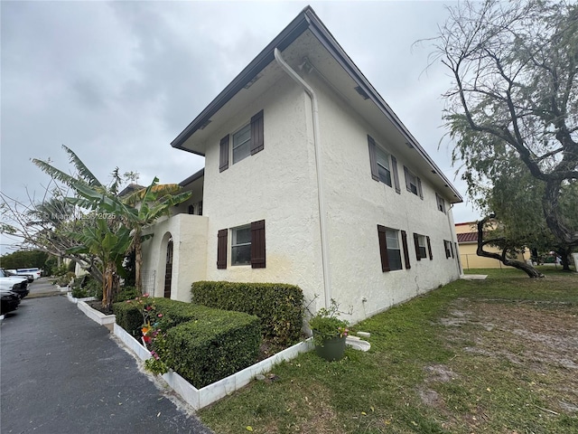 view of home's exterior featuring a lawn