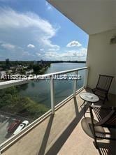 balcony featuring a water view