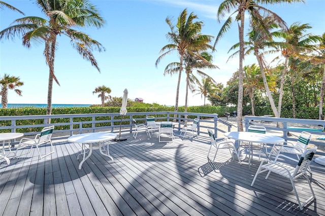 wooden deck featuring a water view