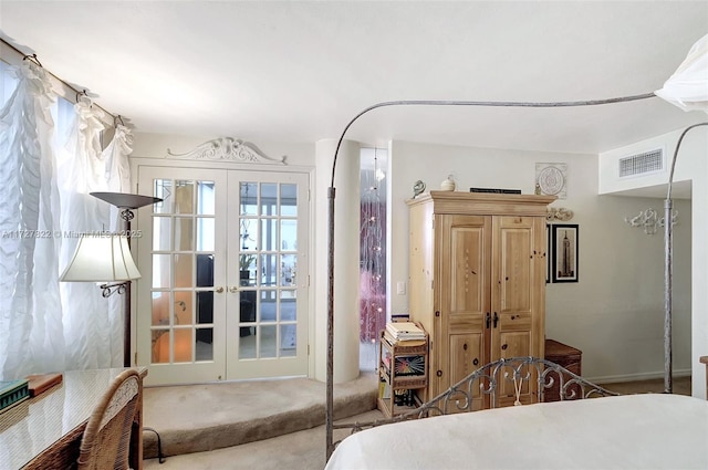 bedroom featuring carpet, visible vents, and french doors