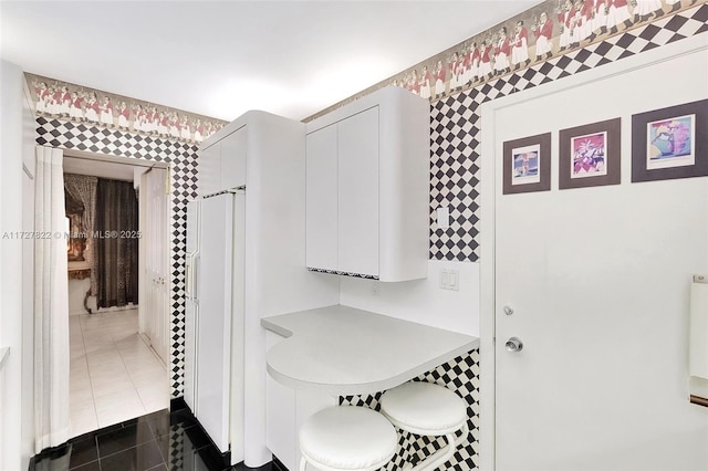 interior space with dark tile patterned floors