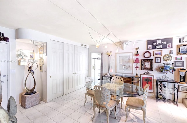 dining area with light tile patterned floors