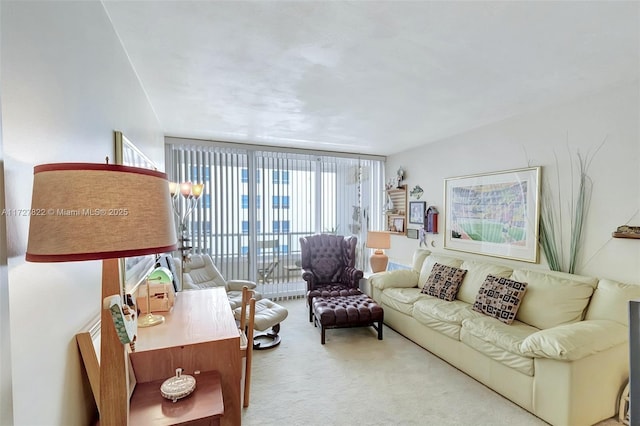 living room with expansive windows and light colored carpet