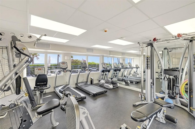 workout area featuring a drop ceiling and visible vents