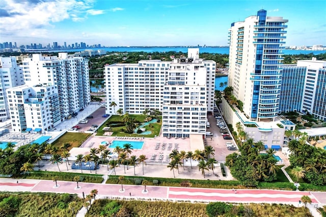 drone / aerial view featuring a water view and a city view