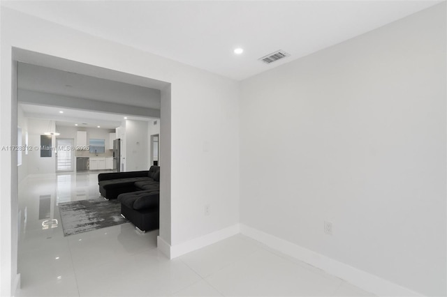 hallway with light tile patterned floors