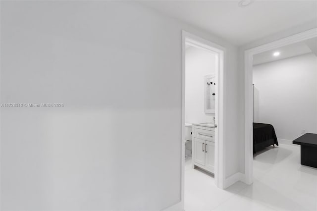 hallway featuring light tile patterned floors