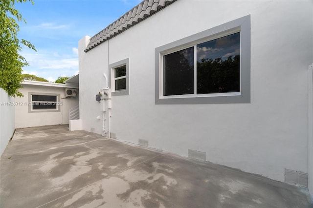 view of side of home featuring a patio