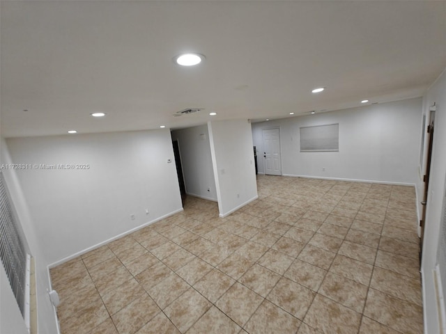 basement featuring light tile patterned floors