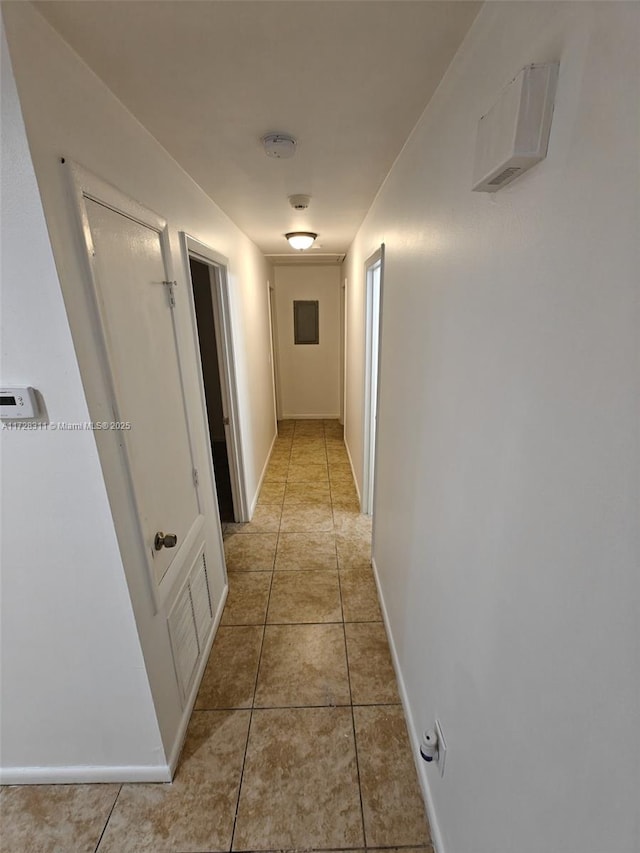 corridor with light tile patterned floors