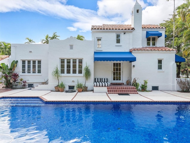 rear view of property featuring a patio