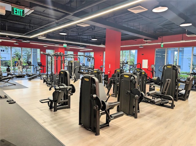 workout area featuring wood finished floors and visible vents