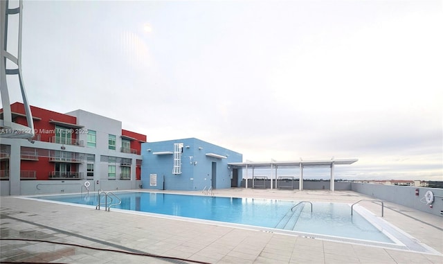 community pool with a patio area