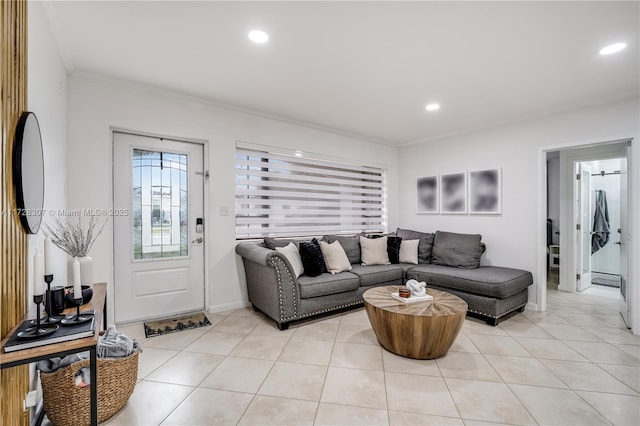 living room featuring light tile patterned floors and ornamental molding