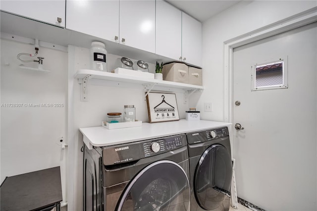 laundry area with cabinets and separate washer and dryer