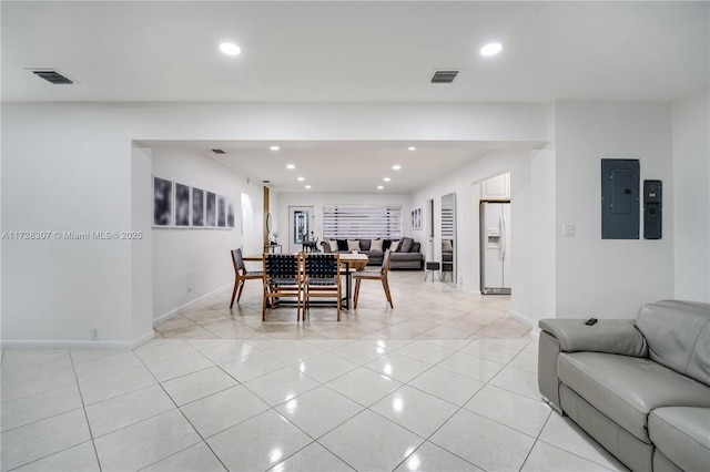 dining room featuring light tile patterned floors and electric panel