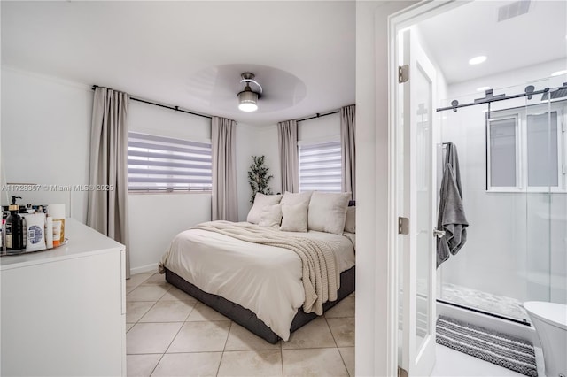 bedroom featuring ceiling fan and light tile patterned floors