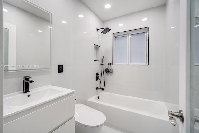 full bathroom featuring toilet, vanity, and bathtub / shower combination