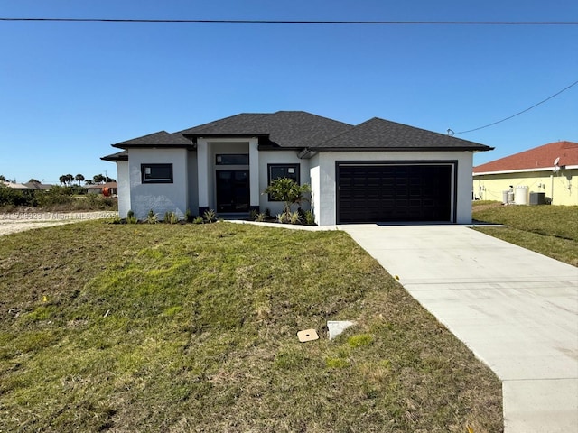 view of side of property with a garage and a lawn