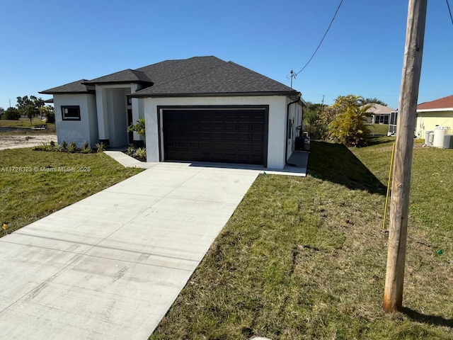 view of front facade featuring a garage and a front yard