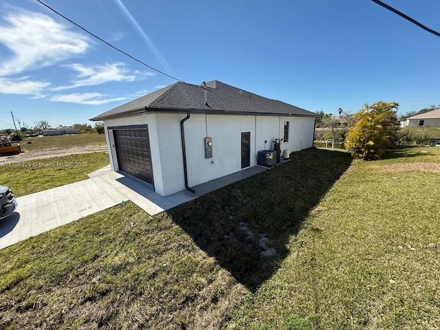 view of home's exterior featuring a yard and a garage