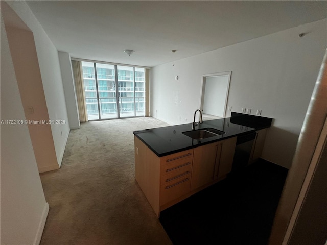 kitchen featuring dishwasher, a wall of windows, sink, kitchen peninsula, and light colored carpet