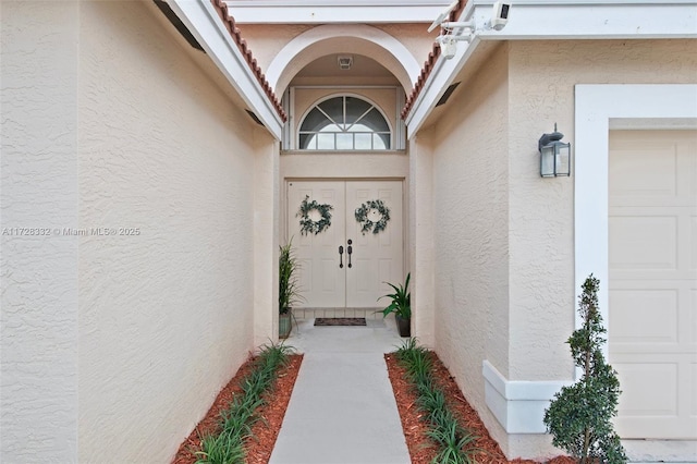 property entrance with a garage