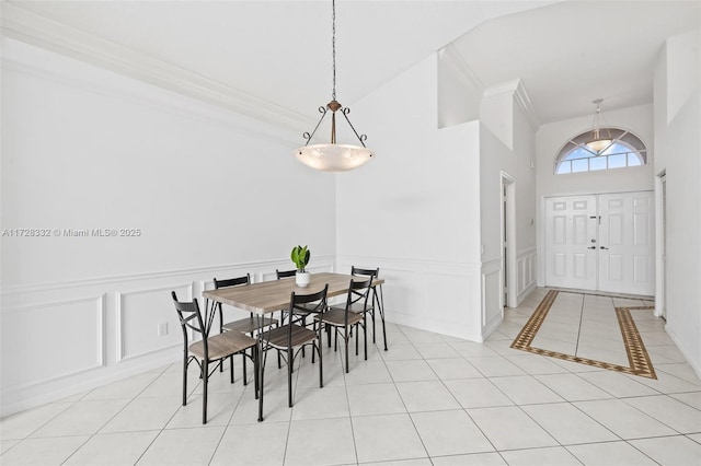 tiled dining area featuring lofted ceiling