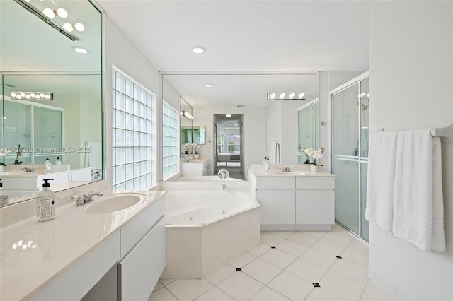 bathroom featuring vanity, tile patterned floors, and plus walk in shower