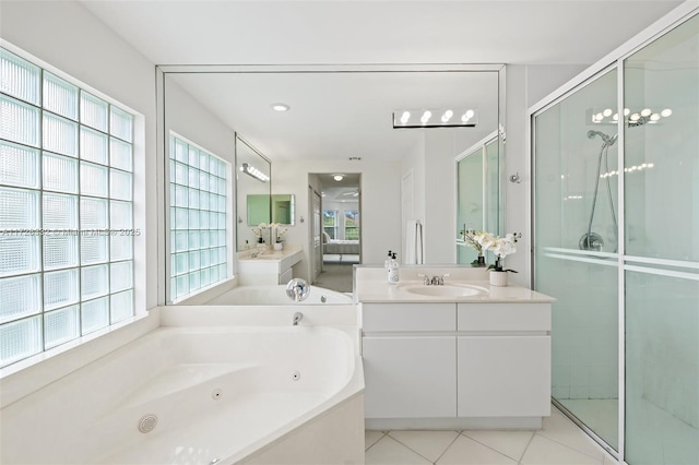 bathroom with vanity, tile patterned flooring, and independent shower and bath